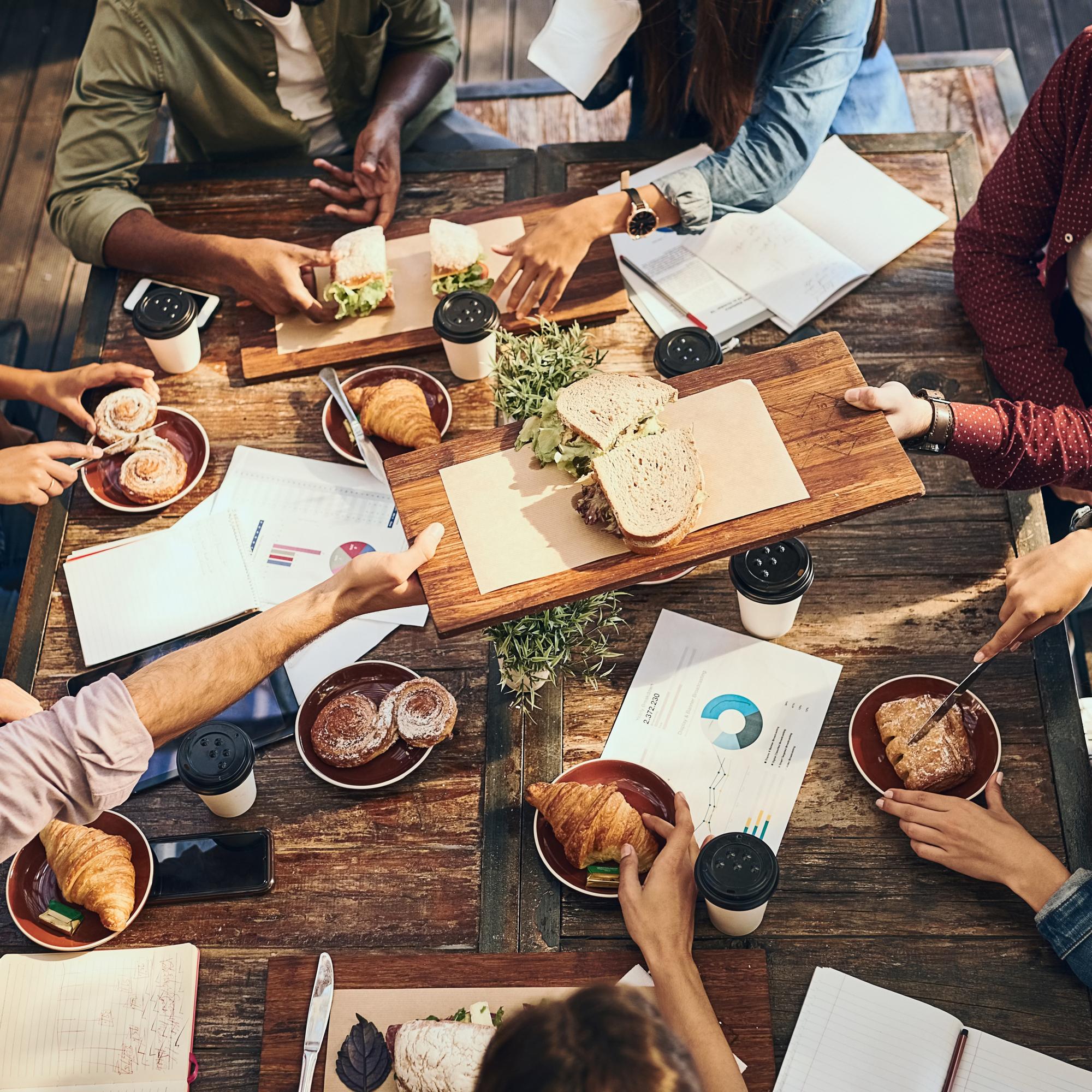 Workshop attendees around a wooden table